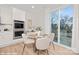 Bright dining area with stylish furniture and a sliding glass door to the deck at 48 Sherwood Nw Ct # Sw48, Concord, NC 28027
