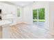 Bright dining area featuring a sliding glass door to the patio and views of the backyard at 48 Sherwood Nw Ct # Sw48, Concord, NC 28027