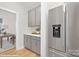 Stainless steel refrigerator and kitchen counter; view into office space at 48 Sherwood Nw Ct # Sw48, Concord, NC 28027