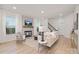 Cozy living room featuring a fireplace, comfortable seating, and lots of natural light at 48 Sherwood Nw Ct # Sw48, Concord, NC 28027