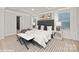This is a beautifully staged main bedroom with a large bed, stylish decor and an ensuite bathroom visible through the doorway at 48 Sherwood Nw Ct # Sw48, Concord, NC 28027