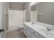 Well-lit bathroom with white double vanity and a shower-tub combo at 507 Quicksilver Trl, Fort Mill, SC 29708