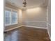 Bright bedroom features hardwood floors, neutral paint, and double window for natural light at 507 Quicksilver Trl, Fort Mill, SC 29708