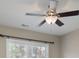 Bedroom with ceiling fan and light fixture in addition to a view of trees from the window at 507 Quicksilver Trl, Fort Mill, SC 29708