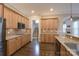 Modern kitchen with stainless steel appliances, granite countertops, and hardwood floors, creating a chef-friendly environment at 507 Quicksilver Trl, Fort Mill, SC 29708