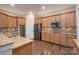 Well-appointed kitchen features stainless appliances, granite countertops, and rich wood cabinetry for a luxurious feel at 507 Quicksilver Trl, Fort Mill, SC 29708