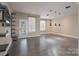 Large living room with dark hardwood flooring, recessed lighting, and lots of natural light at 507 Quicksilver Trl, Fort Mill, SC 29708