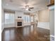 Spacious living room with a stone fireplace, hardwood floors, and natural light at 507 Quicksilver Trl, Fort Mill, SC 29708