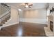 Open living area featuring hardwood floors, wainscoting, and a staircase to the upper level at 507 Quicksilver Trl, Fort Mill, SC 29708