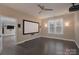 Spacious media room with a large screen, projector, and modern gray-toned flooring offers immersive entertainment at 507 Quicksilver Trl, Fort Mill, SC 29708