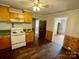 Galley kitchen with wood cabinets and flooring at 807 Phillips Dr, Kings Mountain, NC 28086