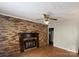 Living room with brick fireplace and hardwood floors at 807 Phillips Dr, Kings Mountain, NC 28086