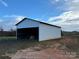 White metal barn with open front and hay bales at 2022 Friendship Church Rd, Taylorsville, NC 28681