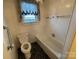 Bathroom with toilet, bathtub and grab bars at 2022 Friendship Church Rd, Taylorsville, NC 28681