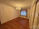 Spacious bedroom with hardwood floors and a chandelier at 2022 Friendship Church Rd, Taylorsville, NC 28681