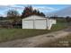 White metal building with double garage doors at 2022 Friendship Church Rd, Taylorsville, NC 28681