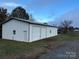 Spacious white metal building with double garage doors at 2022 Friendship Church Rd, Taylorsville, NC 28681