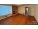 Living room with hardwood floors and stone fireplace at 2022 Friendship Church Rd, Taylorsville, NC 28681