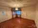 Bright living room featuring hardwood floors and a chandelier at 2022 Friendship Church Rd, Taylorsville, NC 28681