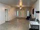 Spacious living area with concrete floors and a view of a kitchenette at 2022 Friendship Church Rd, Taylorsville, NC 28681