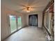 Sunroom with French doors and stone wall at 2022 Friendship Church Rd, Taylorsville, NC 28681