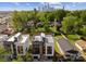 Aerial view of home showcasing rooftop patio, landscaping and cityscape at 217 Keswick Ave, Charlotte, NC 28206