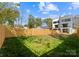 Spacious backyard featuring a privacy fence and lush green grass, perfect for outdoor activities at 217 Keswick Ave, Charlotte, NC 28206