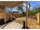 View of the backyard featuring a wooden fence, modern stairs, and newly landscaped area at 217 Keswick Ave, Charlotte, NC 28206