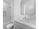 Bathroom featuring white subway tile, shower-tub combo and vanity with quartz countertop at 217 Keswick Ave, Charlotte, NC 28206