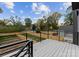 Large deck area with sleek railing overlooking the fenced-in backyard at 217 Keswick Ave, Charlotte, NC 28206