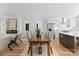 Bright dining area with modern furnishings seamlessly connects the living and kitchen spaces at 217 Keswick Ave, Charlotte, NC 28206