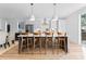 Stylish kitchen island with seating for four, modern pendant lights, and sleek countertops at 217 Keswick Ave, Charlotte, NC 28206