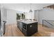 Kitchen island with dishwasher and microwave and natural light from the glass door at 217 Keswick Ave, Charlotte, NC 28206