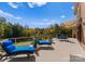 Expansive deck with lounge chairs, an awning, and scenic views offers a luxurious outdoor retreat at 2723 Providence Pine Ln, Charlotte, NC 28270