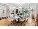 Elegant dining room featuring a large table, modern chairs, and abundant natural light at 2723 Providence Pine Ln, Charlotte, NC 28270