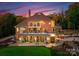Elegant home with landscaped grounds featuring a putting green and outdoor living spaces at 2723 Providence Pine Ln, Charlotte, NC 28270