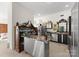 A well appointed kitchen area featuring a stylish bar, stainless steel appliances, and modern cabinetry at 2723 Providence Pine Ln, Charlotte, NC 28270