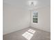 Bright bedroom with carpeted floor and large window at 2807 Station Sw Ln, Concord, NC 28025