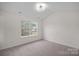 Bright bedroom with neutral walls and carpeted floors at 2807 Station Sw Ln, Concord, NC 28025