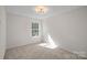 Simple bedroom with neutral walls and carpet at 2807 Station Sw Ln, Concord, NC 28025