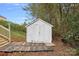 White storage shed in backyard at 2807 Station Sw Ln, Concord, NC 28025