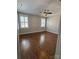 Spacious bedroom with hardwood floors and a ceiling fan at 376 Delburg St, Davidson, NC 28036