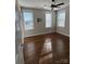 Bright bedroom with hardwood floors and multiple windows at 376 Delburg St, Davidson, NC 28036