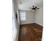 Well-lit bedroom featuring hardwood floors and a ceiling fan at 376 Delburg St, Davidson, NC 28036