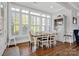 Bright breakfast nook with a farmhouse table and built-in shelving at 376 Delburg St, Davidson, NC 28036