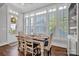 Charming breakfast nook boasts a farmhouse table and abundant natural light at 376 Delburg St, Davidson, NC 28036