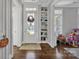 Bright entryway with built-in shelving and hardwood floors at 376 Delburg St, Davidson, NC 28036