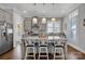 Modern kitchen with gray cabinets, granite countertops, and an island at 376 Delburg St, Davidson, NC 28036