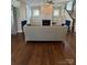 Living room with hardwood floors, fireplace, and built-in shelves at 376 Delburg St, Davidson, NC 28036