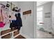 Mudroom with built-in bench, cubbies, and coat hooks at 376 Delburg St, Davidson, NC 28036